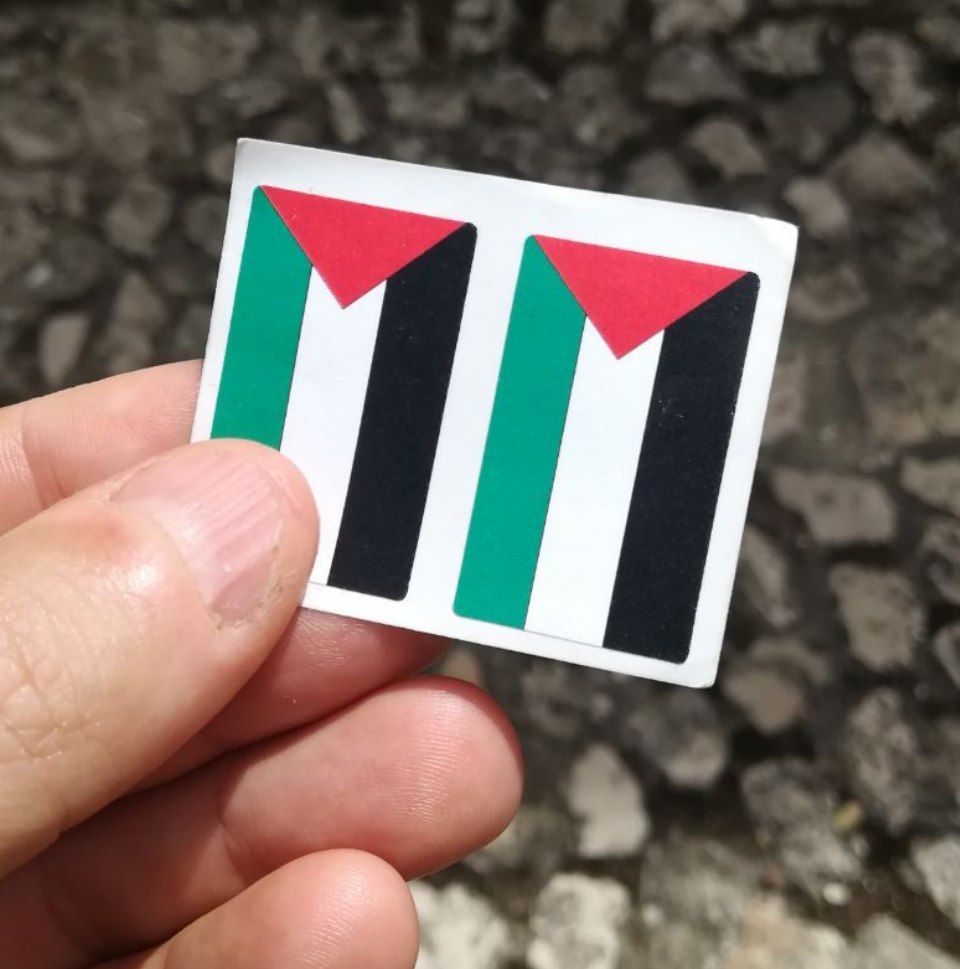 Pair of thumb-sized flag stickers